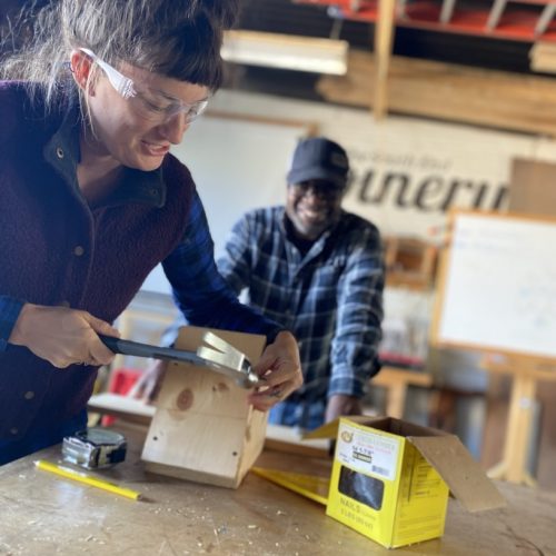 Focused training in progress at ReSOURCE Vermont, where individuals learn valuable construction skills, contributing to workforce development and sustainable job creation.