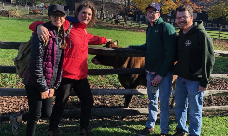 A group of LEAP participants standing next to a fence.